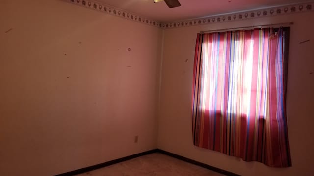 unfurnished room featuring ceiling fan