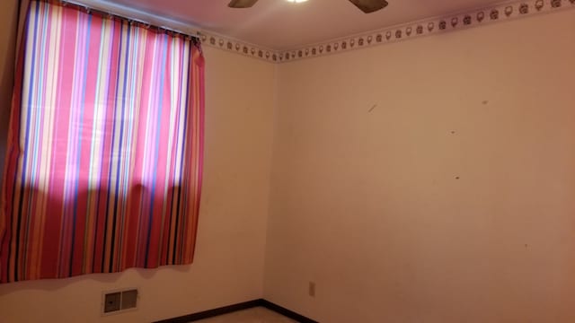 spare room featuring ceiling fan