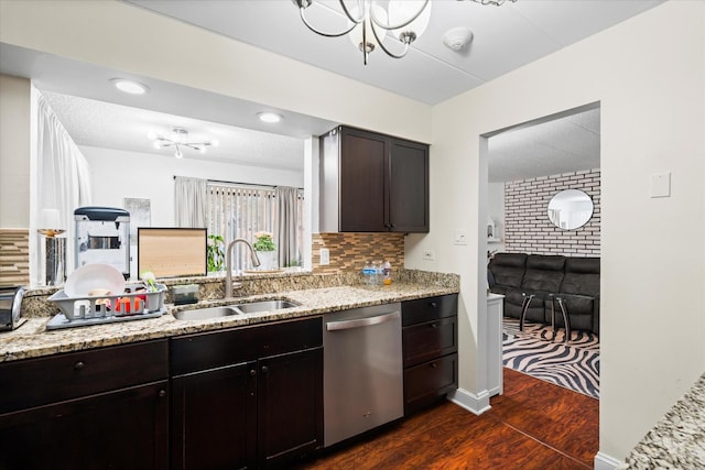 kitchen with dark hardwood / wood-style flooring, tasteful backsplash, dark brown cabinets, sink, and dishwasher