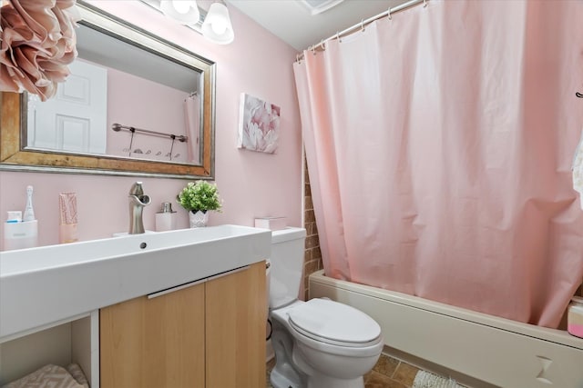 full bathroom featuring vanity, toilet, and shower / bath combo with shower curtain