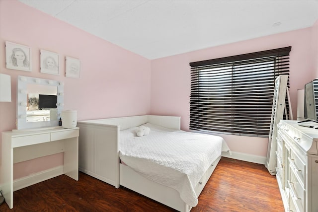 bedroom featuring dark hardwood / wood-style flooring