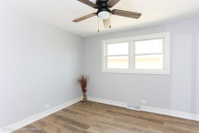 unfurnished room featuring ceiling fan and dark hardwood / wood-style floors