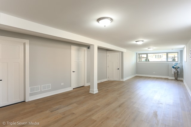 basement featuring light hardwood / wood-style flooring