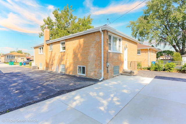 view of side of home featuring a patio