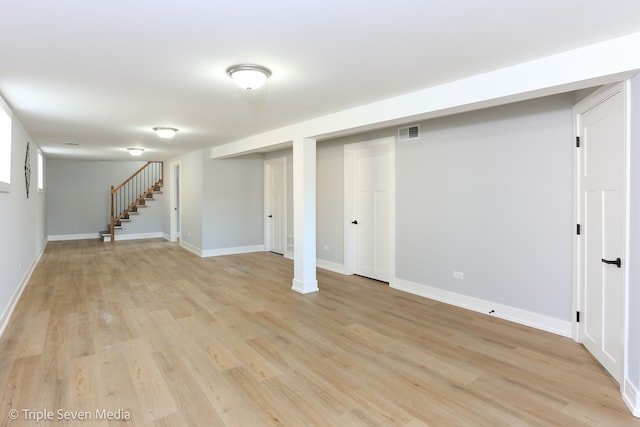 basement featuring light wood-type flooring