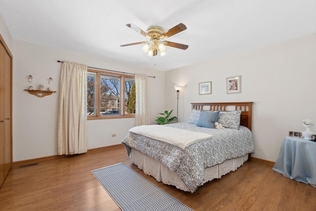 bedroom featuring hardwood / wood-style flooring and ceiling fan