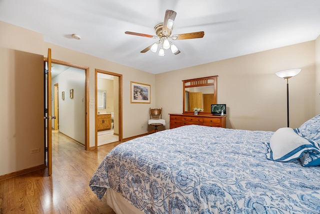 bedroom featuring connected bathroom, ceiling fan, and light hardwood / wood-style floors