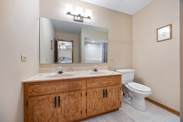 bathroom with tile patterned flooring, vanity, curtained shower, and toilet