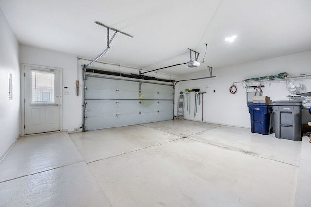 garage featuring a garage door opener