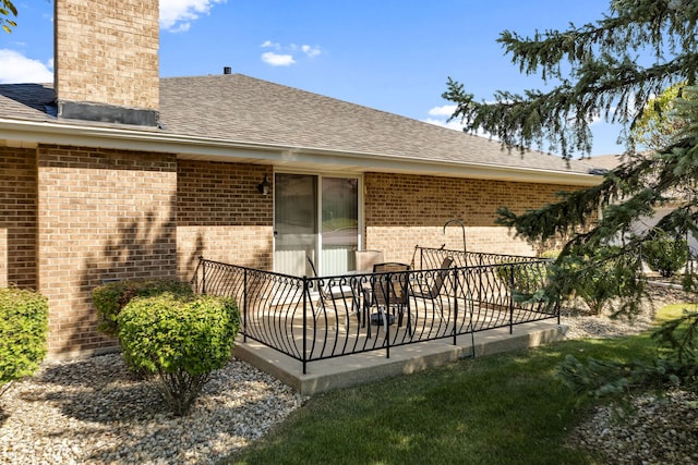 back of house with a patio