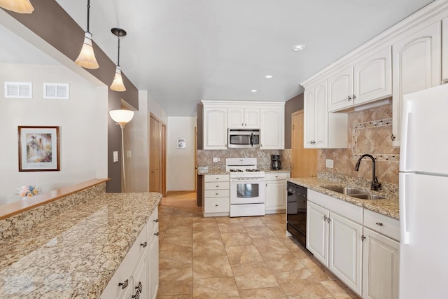 kitchen with sink, white cabinets, decorative backsplash, hanging light fixtures, and white appliances