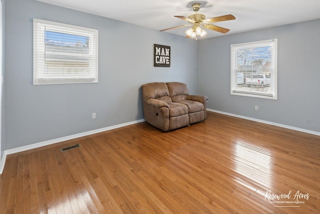 unfurnished room with ceiling fan and light hardwood / wood-style floors