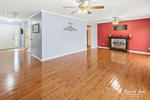 unfurnished living room with crown molding, ceiling fan, and hardwood / wood-style flooring