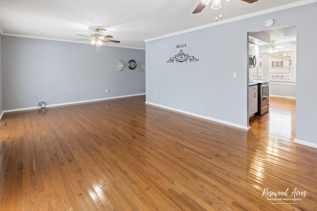 empty room featuring wood-type flooring and crown molding