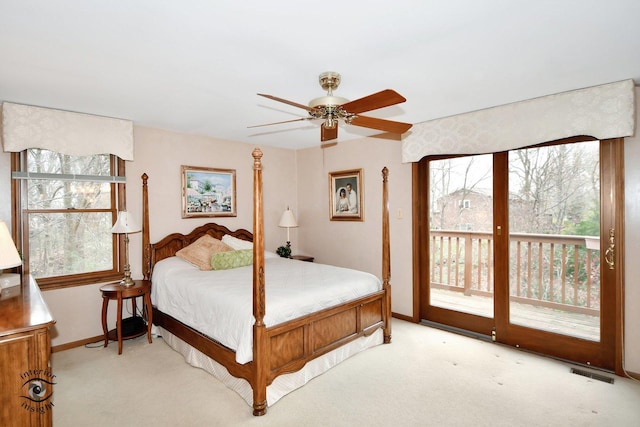 carpeted bedroom featuring access to outside and ceiling fan