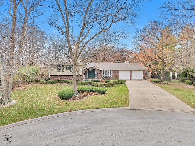 ranch-style house featuring a garage and a front lawn