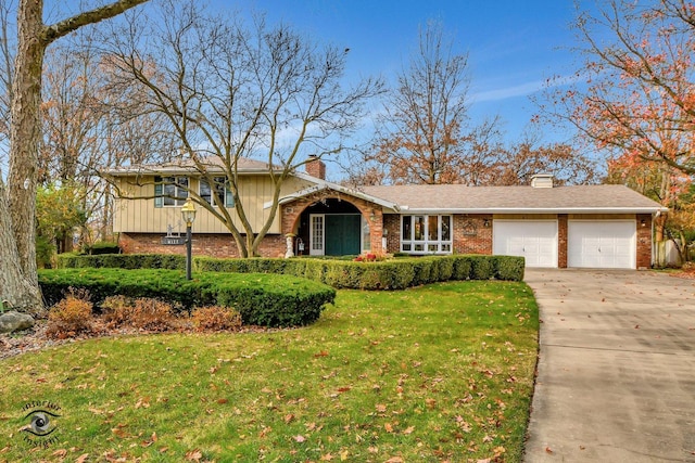 view of front of property with a garage and a front yard