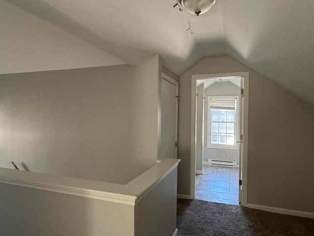 bonus room with carpet flooring, lofted ceiling, and a baseboard heating unit