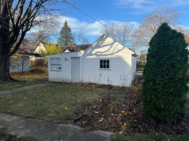 view of property exterior with a yard