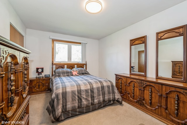 bedroom with light carpet