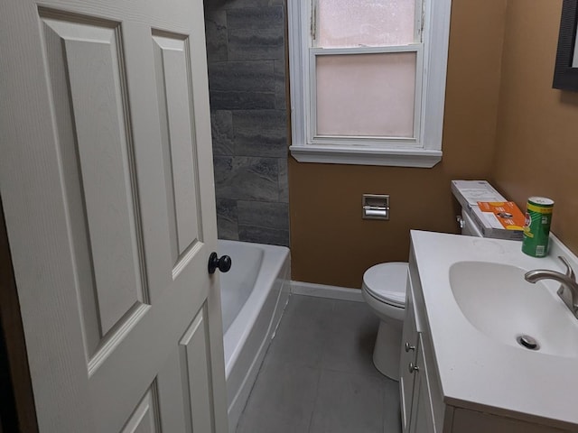 bathroom with tile patterned flooring, vanity, toilet, and a bath