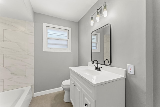 bathroom featuring tile patterned flooring, vanity, and toilet