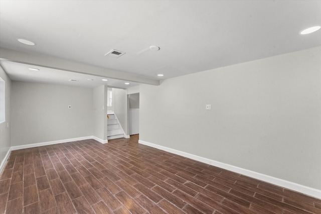 basement featuring dark hardwood / wood-style floors