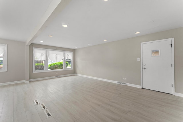 unfurnished living room with light hardwood / wood-style floors