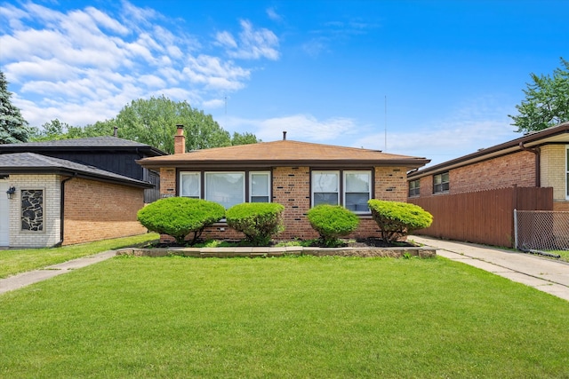 single story home featuring a front yard