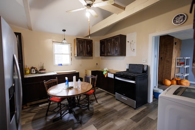 kitchen featuring decorative light fixtures, dark brown cabinets, dark hardwood / wood-style flooring, stainless steel appliances, and washer / clothes dryer