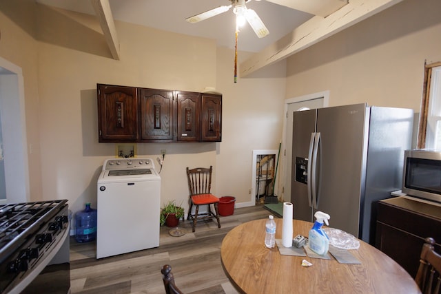 kitchen with dark brown cabinetry, stainless steel appliances, ceiling fan, washer / dryer, and light hardwood / wood-style floors