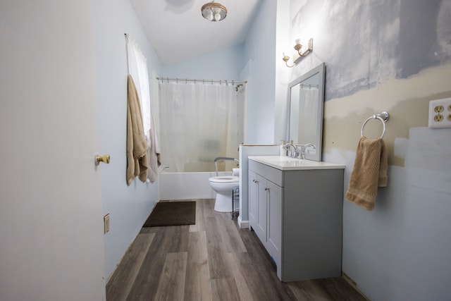 full bathroom featuring shower / bath combo, vanity, vaulted ceiling, hardwood / wood-style flooring, and toilet