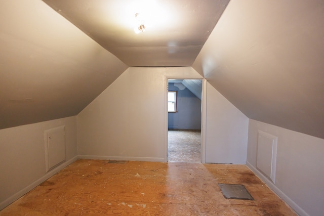 additional living space with vaulted ceiling