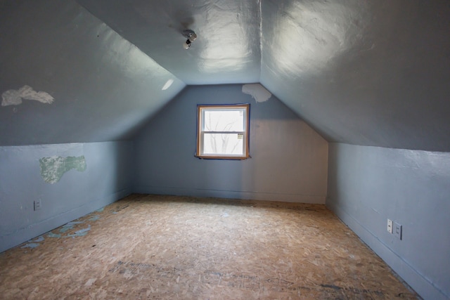 additional living space with vaulted ceiling