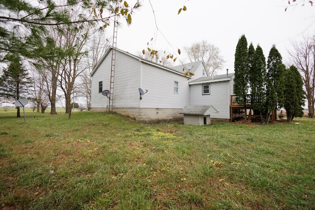 exterior space with a lawn and a deck