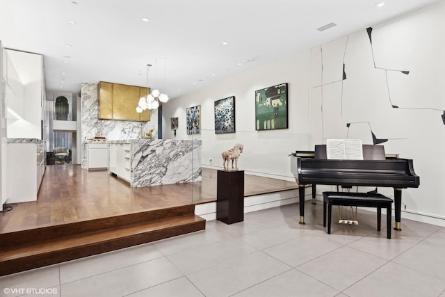 interior space featuring recessed lighting, visible vents, and a notable chandelier