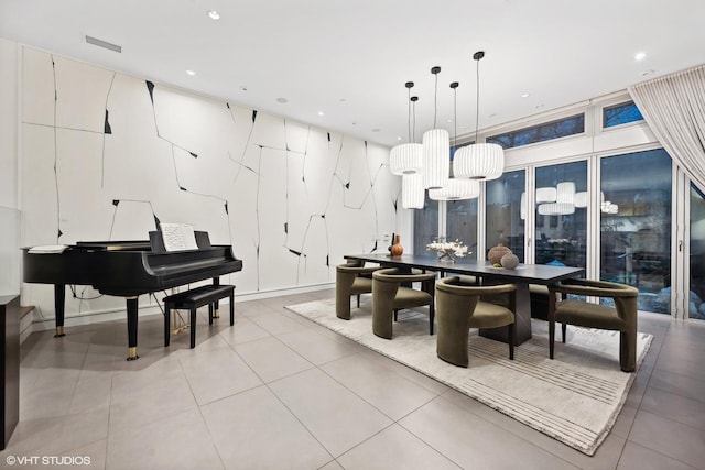 dining area with light tile patterned floors, visible vents, a wall of windows, and recessed lighting