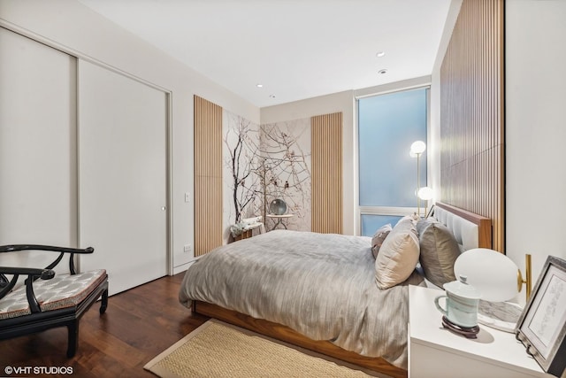 bedroom featuring recessed lighting and wood finished floors