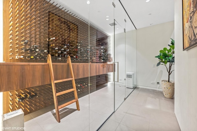 wine area featuring tile patterned floors and visible vents