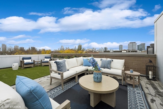 view of patio / terrace featuring a view of city and an outdoor hangout area