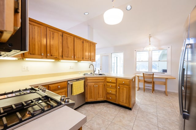 kitchen with sink, hanging light fixtures, kitchen peninsula, and stainless steel appliances