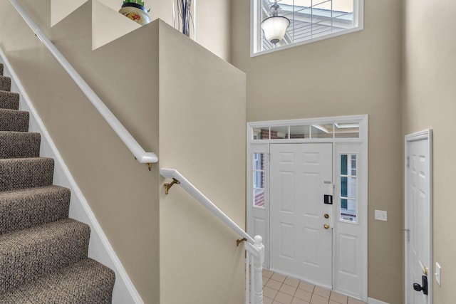 entryway featuring light tile patterned floors