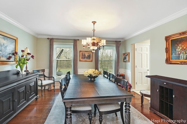 dining space with ornamental molding, dark hardwood / wood-style floors, and a chandelier