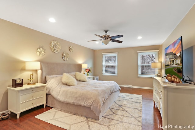 bedroom featuring dark wood-type flooring and ceiling fan