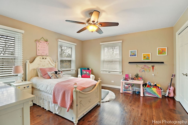 bedroom with ceiling fan and dark hardwood / wood-style flooring