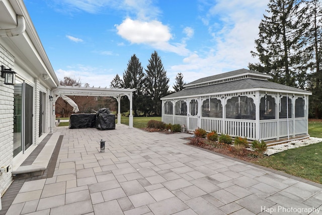 view of patio with a sunroom