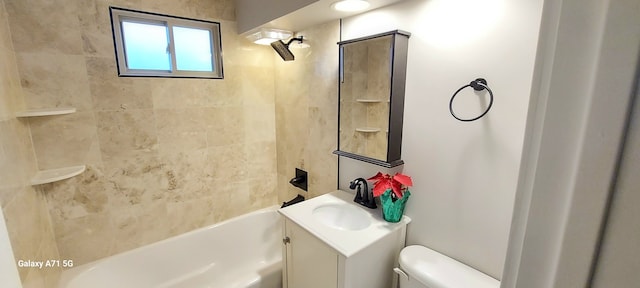 full bathroom featuring vanity, toilet, and tiled shower / bath