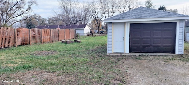 garage featuring a lawn