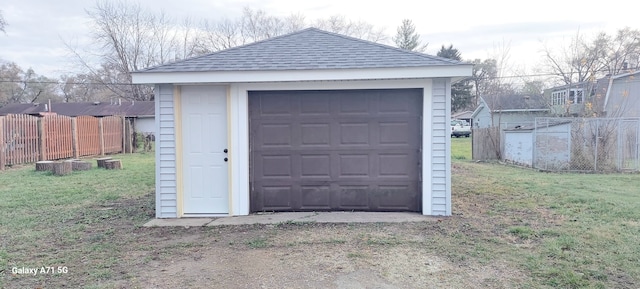 garage with a lawn