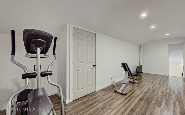 workout room with light hardwood / wood-style flooring